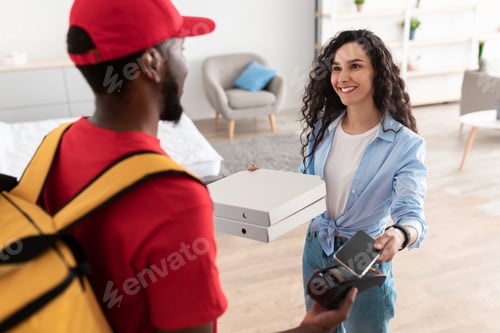 Preview: Black delivery man holding pizza box and pos terminal
