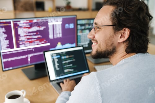 Preview: Image of programmer man wearing eyeglasses working with computers