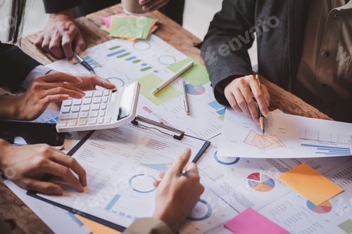 Preview: Business Professionals Analyze Financial Report Together in Office