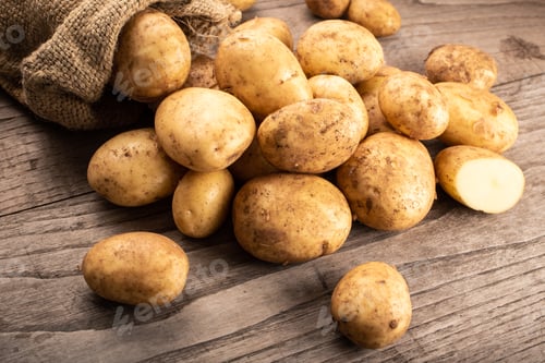 Preview: New potatoes on wooden background
