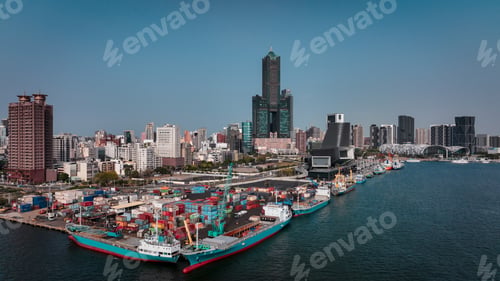 Preview: Aerial view of the bustling port and skyline of Kaohsiung, Taiwan in bright daylight conditions