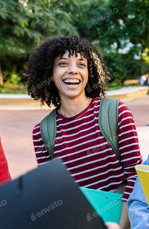 Preview: Young adult African American student girl talking with friends at campus