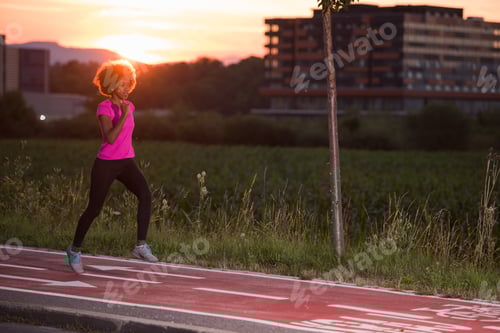 Preview: a young African American woman jogging outdoors