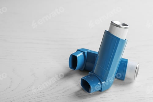 Preview: Asthma inhalers and space for text on white wooden background