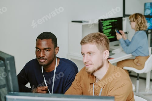 Preview: Two Young Men Coworking in Office