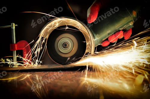 Preview: Worker cutting metal with grinder