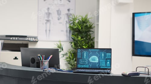 Preview: Laptop showing tomography scan at desk