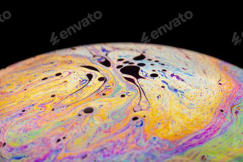 Preview: Multicolored abstract chaotic pattern inside of the soap bubble, closeup