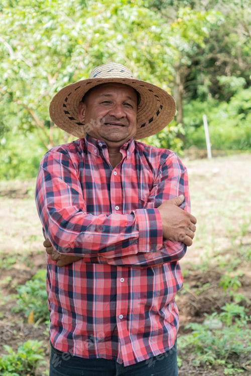 Preview: Portrait of Smiling Farmer standing in a crop