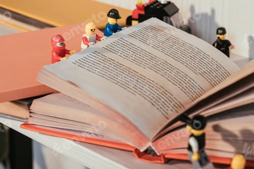 Preview: KYIV, UKRAINE - MARCH 15, 2019: selective focus of colorful plastic lego minifigures turning book