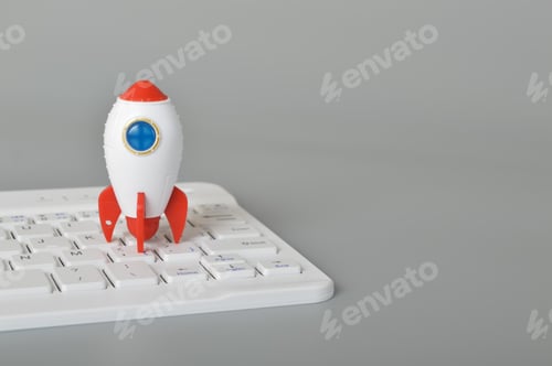 Preview: Toy rocket and laptop keyboard.The symbol for success is Start-up, business, education and knowledge