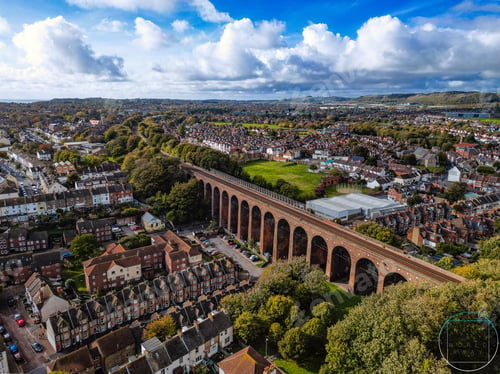 Preview: Aerial shot of the Kent Viaduct bridge in the urban town surrounded by trees and houses