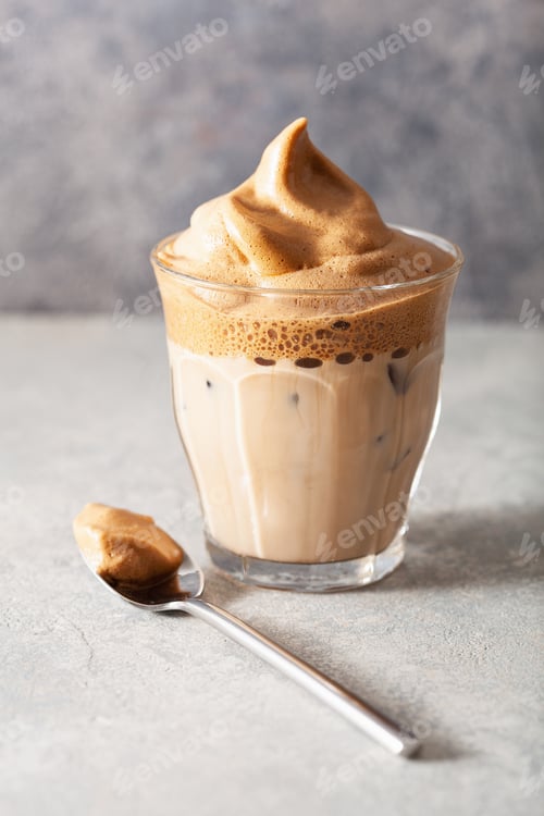Preview: dalgona coffee in glass. trendy Instant coffee whipped with sugar and hot water