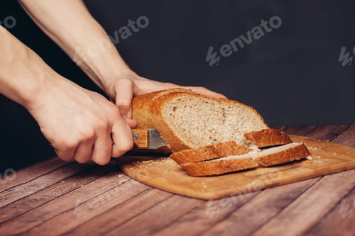 Preview: slicing loaf on a cutting board wooden table kitchen food flour product