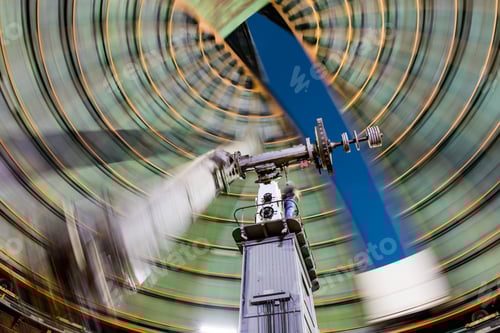 Preview: Technician operating the positioning of an old telescope