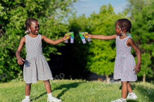 Preview: Two african american girls playing in the park