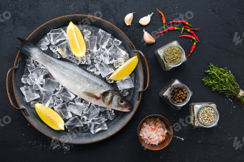 Preview: Raw seabass fish on wooden background