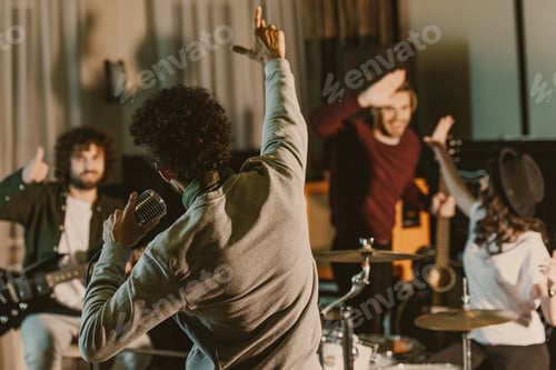 Preview: singer stretching hand to happy music band while they having repetition