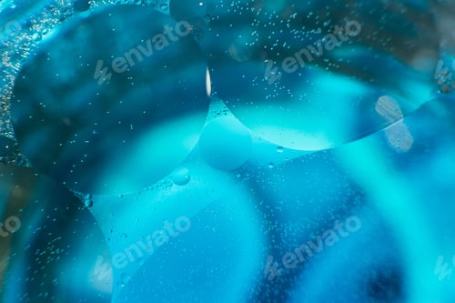 Preview: Oil bubbles close up. circles of water macro. abstract light blue background