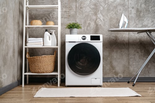 Preview: Washing machine in a gray modern laundry room