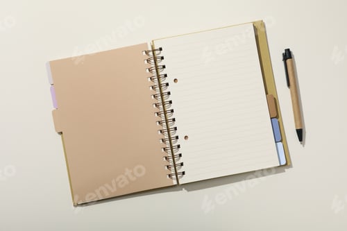 Preview: Notebook and stationery on the table, top view.