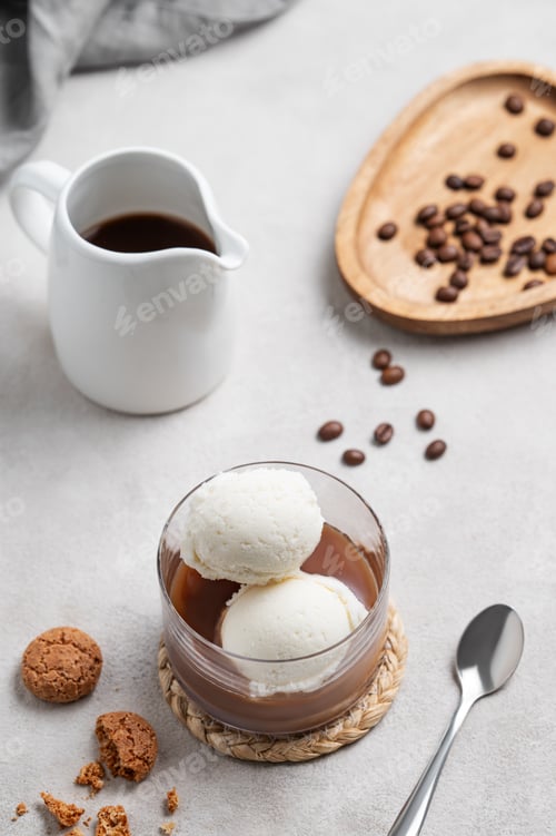 Preview: Affogato coffee with vanilla ice cream scoops and strong espresso in a glass on a light background