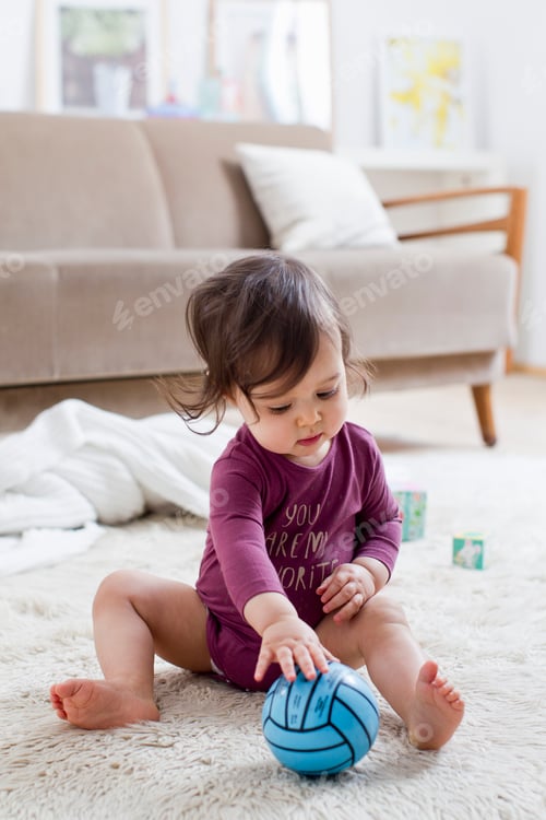 Preview: Baby boy playing on floor