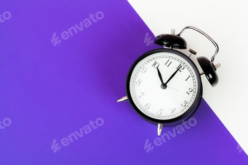 Preview: Vintage black alarm clock on lilac background