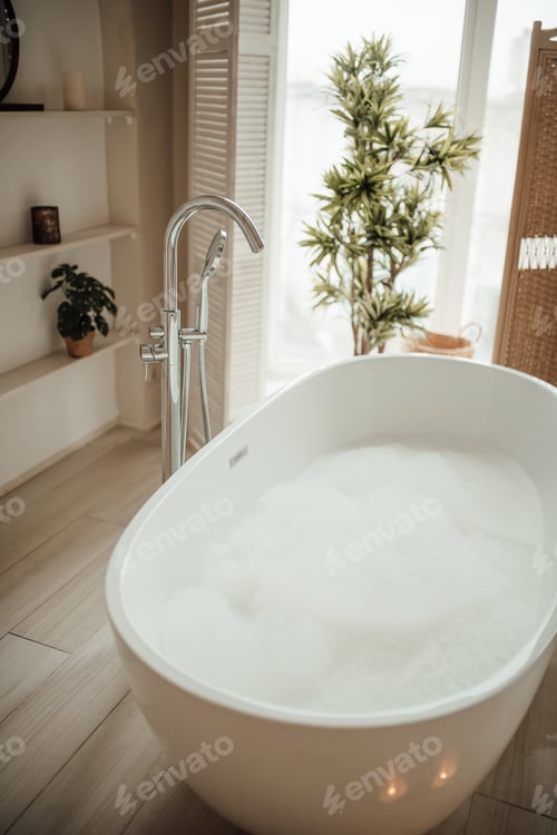 Preview: Soft native hues organic shapes look of bathroom with big window oval bathtub in neutrals tones