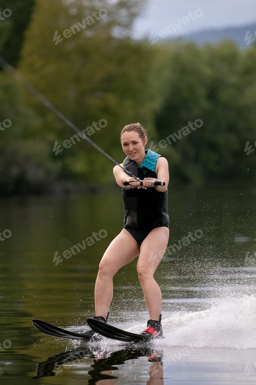 Preview: Charming young woman goes water skiing