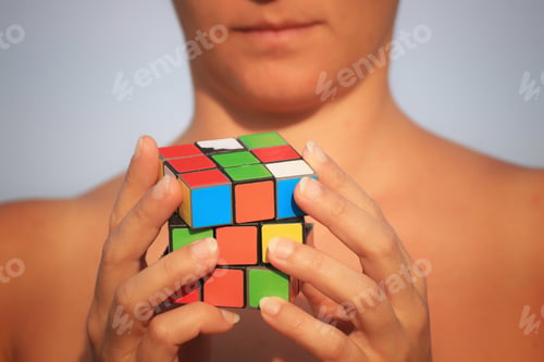 Preview: Woman holding mini rubik cube