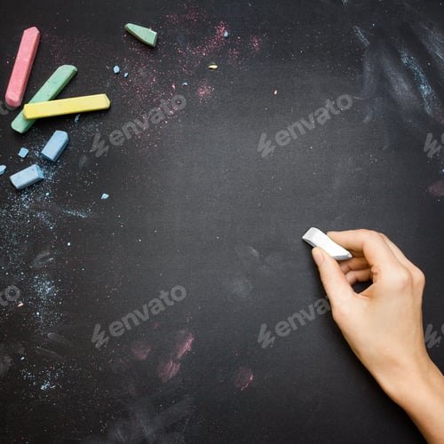 Preview: Female hand writing on a blackboard tabletop with white chalk