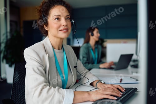 Preview: Customer service representative working on desktop PC in the office.