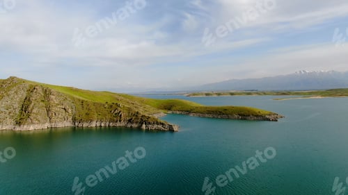 Preview: Aerial view of a reservoir with fresh water with the mountains in the background