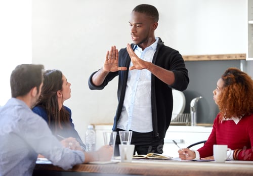 Preview: Cropped shot of a young businessman addressing his colleagues during a business meeting