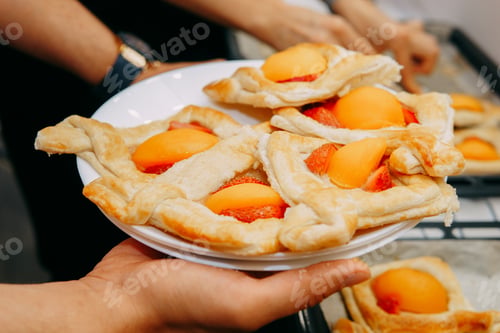 Preview: Preparing a dessert at a cooking master class. Baskets with peaches and strawberries, home cooking.
