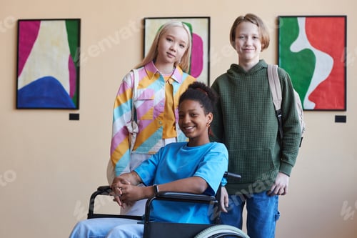 Preview: Colorful inclusive group of teenagers smiling at camera visiting art gallery