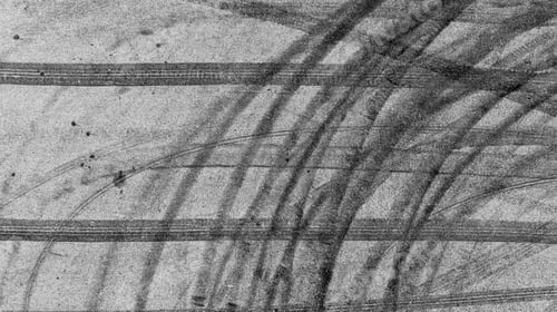 Preview: Aerial view tire track mark on asphalt tarmac road race track texture and background.