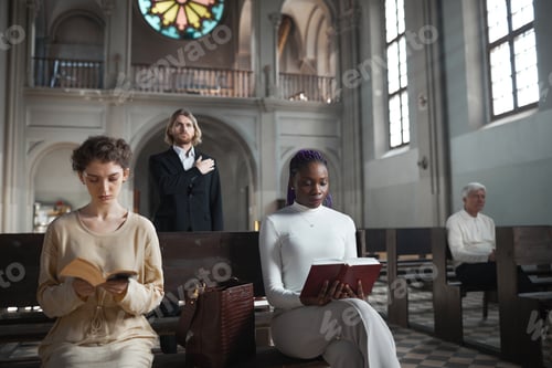 Preview: People praying during mass