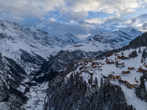 Preview: Murren Town and Mountains in Winter Evening. Switzerland. Aerial View