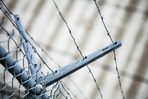 Preview: Outdoor Fence Detail of Sharp Barbwire Installation.