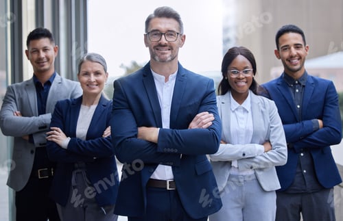 Preview: Cropped portrait of a group of corporate businesspeople standing outside with their arms folded