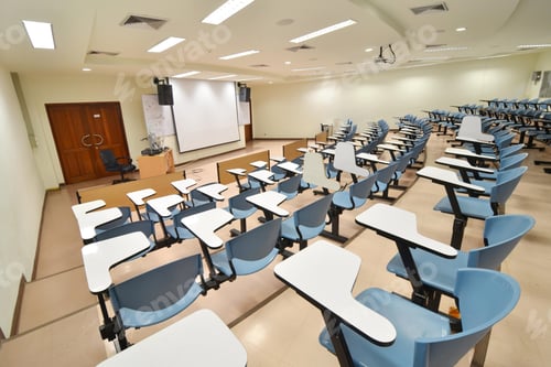 Preview: Empty Lecture Hall with Blue Seating and Whiteboards