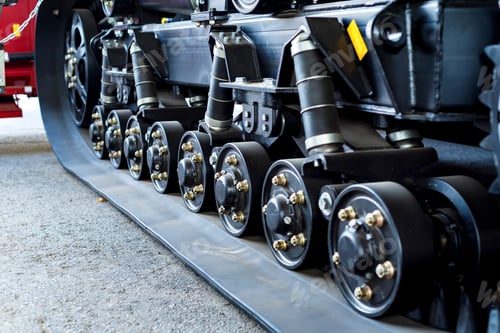 Preview: A close up of modern rubber tractor tracks