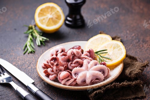 Preview: Baby octopus in plate with lemon and rosemary