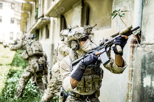 Preview: Soldier in full US MARSOC armed with assault rifle run through the abandoned building. Military