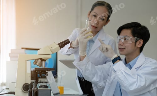 Preview: medical doctor working in research lab. Science assistant making pharmaceutical experiments
