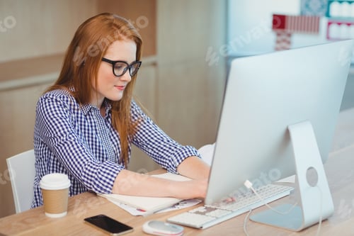 Preview: Female executive working on computer