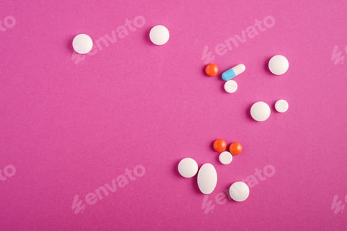 Preview: Pills and tablets on pink background, healthcare medical concept, antibiotics and cure