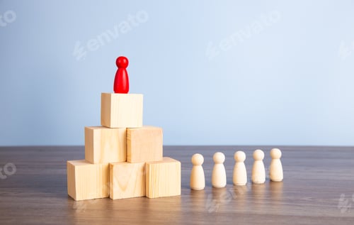 Preview: Wooden people figures on top of wooden blocks. Career growth, development and leadership